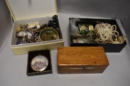 A selection of vintage costume jewellery including necklaces, cap badges etc