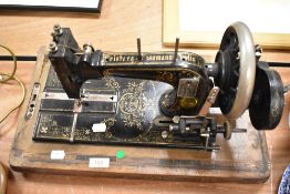 A Victorian Rister and Issman hand cranked sewing machine
