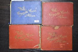 A selection of early 20th century cigarette card sets including sport and transport interest
