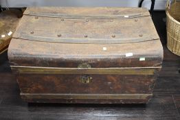 A large grained metal tin trunk or case