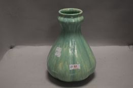 An antique Royal Lancastrian pottery vase, of lobed baluster form with green glaze, no 2335