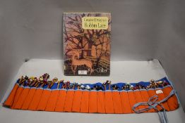 A selection of 20th century lace bobbins with creative design book