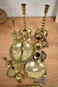 A selection of brass wares including cast twist stem candle sticks and trench art letter opener