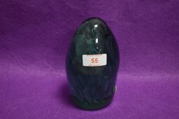 A Victorian aqua green glass dump weight, having controlled bubble centre