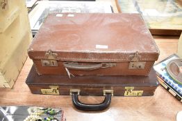 A selection of geological rock and mineral specimens with two leather cases