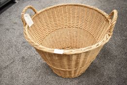 A woven wicker wash or laundry basket