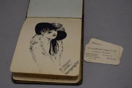 A 20th century autograph book containing poems sketches and illustrations
