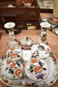 A Victorian dressing table set including candle sticks and lidded containers