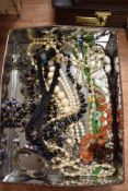 A selection of costume jewellery including necklaces and simulated pearls