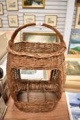 A dairy or similar wicker basket having bottle compartment