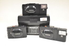 Three Olympus XA cameras one boxed and cased