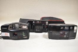Three cameras, An Olympus AF-1 Twin, a Canon AF-7 Sureshot and a Minolta AF-EII