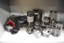 Six lenses. Two Tamron SP telephoto 80-210mm, a Ohnar 300mm mirror lens, a Vivitar 500mm mirror
