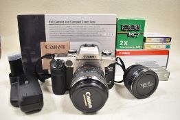 A Canon EOS50E with Canon Zoom EF 28-105mm f3,5 to 4,5 lens, Canon battery pack, C-AF1 tele
