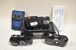 Three Olympus cameras. An Olympus XA camera cased and boxed, An Olumpus U(MJU)-1 and an Olympus U(