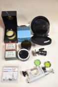 Two boxes of various filters, close up lenses etc