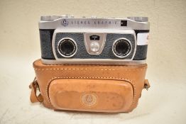 A Graflex Stereo Graphic camera No1008095 with Graflex 35mm f4 lens in original leather cover