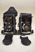 Two Mamiya cameras. A Mamiya C330 Professional f with a Mamiya-Sekor 80mm f2,8 lens and a Mamiya