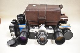 A Praktica PLC3 SLR camera with a Prakticar MC 50mm 1,8 lens, a Prakticar MC 135 2,8 lens, a