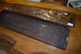 An arts and crafts style copper plaque depicting woman blowing horn with an Indian style tray