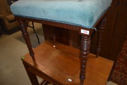 A Victorian stool having mahogany turned legs and later dralon buttoned upholstery