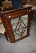 Victorian corner cupboard having astral glazed front with inlayed decoration
