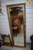 A vintage full length gilt frame wall mirror