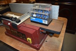 A bench mounted woodworking Rexon J-1560A planner router bits not included