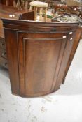 A 19th Century mahogany bow fronted corner cupboard