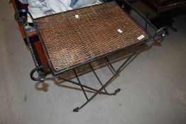 A modern metal and wicker stand