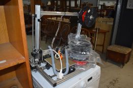 A modern 3d printer by Velleman for spares or repair with three unused filament spools