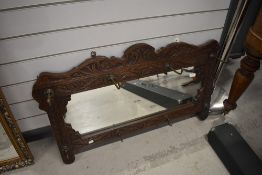 A Victorian carved oak hall mirror