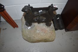 A stone mounted cast boot scraper