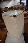 20th century Lloyd loom laundry basket painted white with glass top