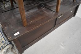 A stained frame underbed style storage box