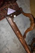 An Arts & Crafts copper fire fender having traditional hammered finish