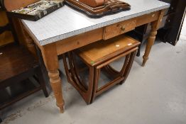 A mid century pine and formica topped utility or kitchen table