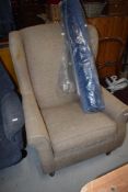 A modern easy chair and a modern carpet piece