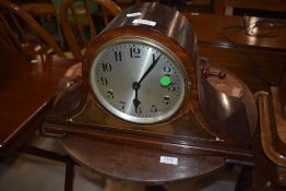 An early 20th Century mahogany mantel clock in napoleon style