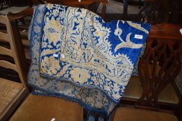 A traditional silk carpet/throw having blue ground