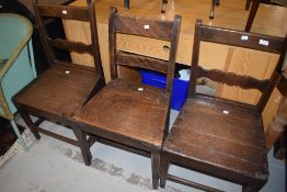 Early 19th century oak provincial style solid seat farm house chairs one matching pair plus one