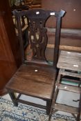 A period oak solid seat chair having shaped back and square frame