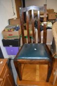 An early 20th Century stained frame dining chair with vinyl drop in seat