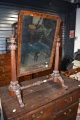 A 19th Century mahogany toilet mirror having elaborate frame and scroll feet