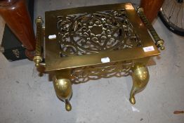 A Victorian brass footman