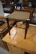 20th century mahogany and oak framed foot stool with woven fibre top