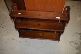 A Victorian mahogany wall shelf in the gothic style