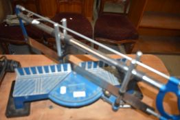 A compound mitre saw and guard