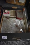 A selection of scientific chemistry equipment mostly glass vessels and test tubes etc
