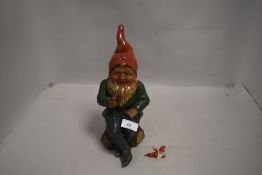 A 20th century German hand painted ceramic garden gnome figure